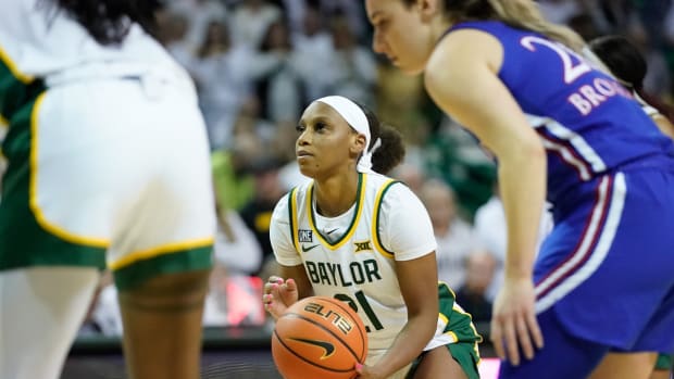 Feb 26, 2022; Waco, Texas, USA; Baylor Lady Bears guard Ja'Mee Asberry (21) shoots a free throw against the Kansas Jayhawks during the second half at Ferrell Center. Mandatory Credit: Chris Jones-USA TODAY Sports